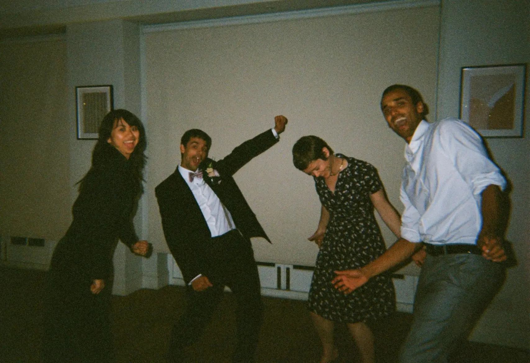 Cropped 35mm film photo of wedding guests dancing